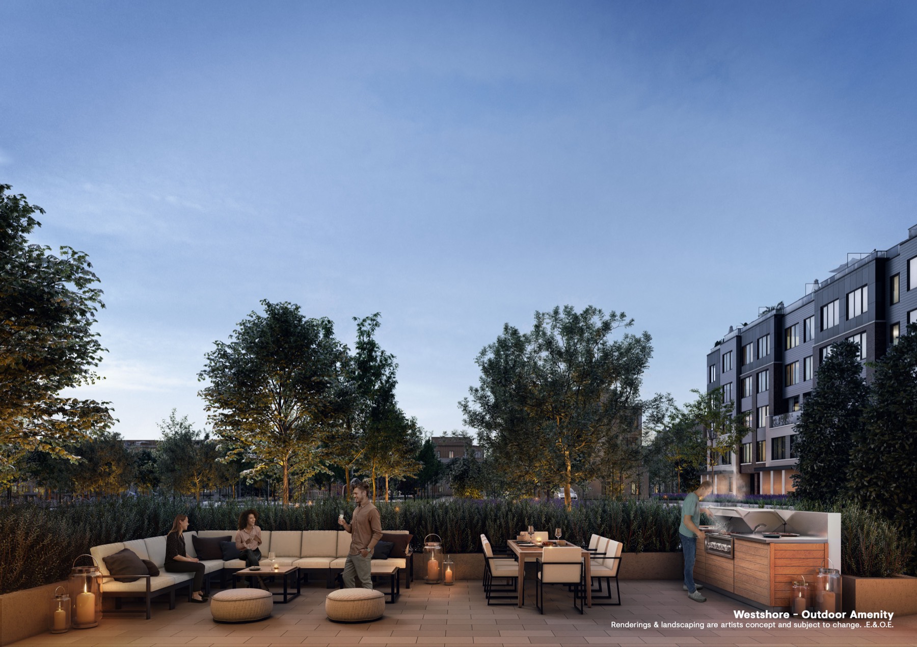 Outdoor amenity terrace at dusk with sofas, dining table and an outdoor kitchen