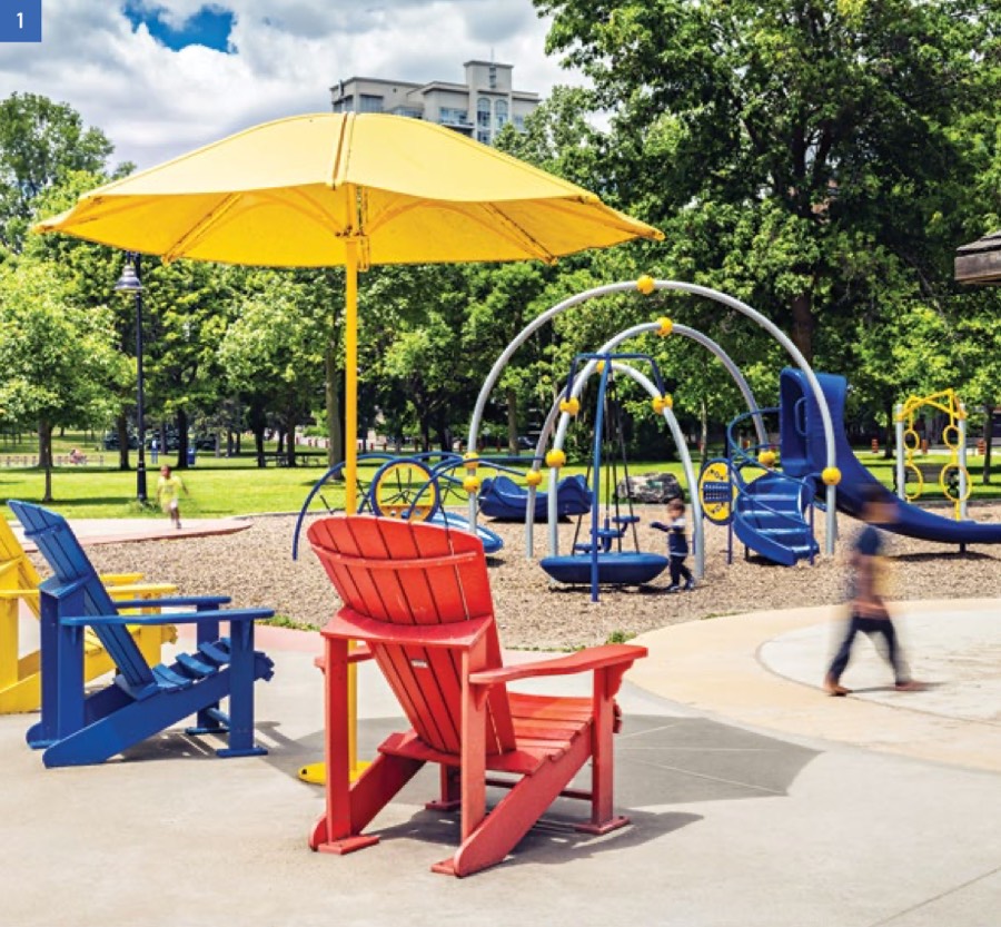 Colourful Muskoka chairs and a playground under a yellow umbrella in Marie Curtis Park